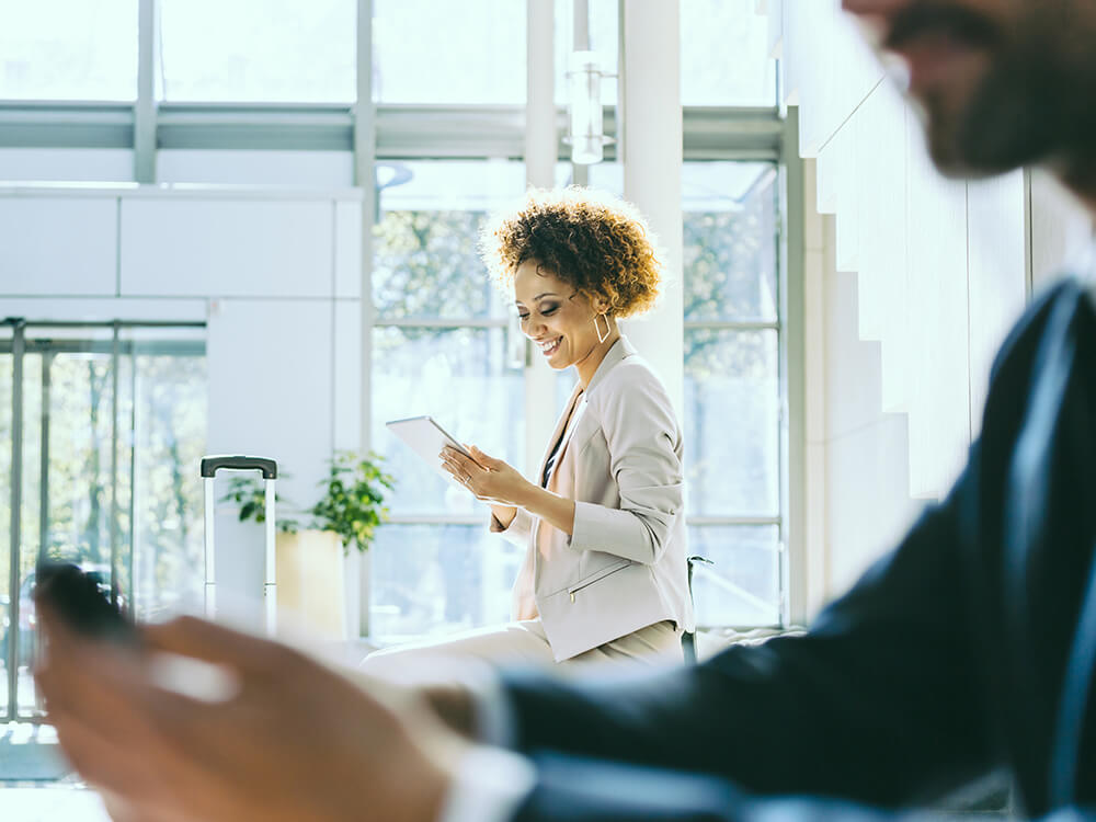 Woman in an advisory firm office using a tablet